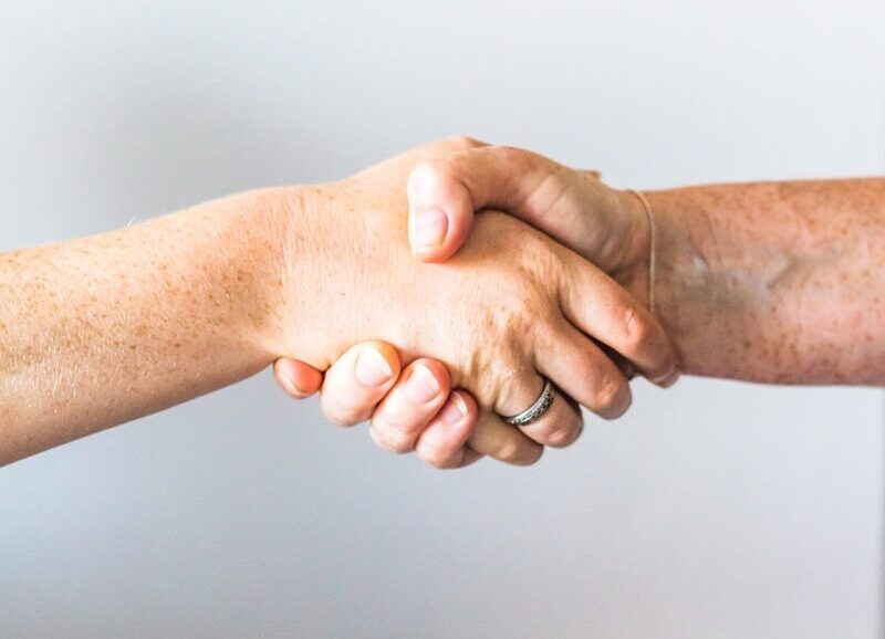 person holding hands of another person